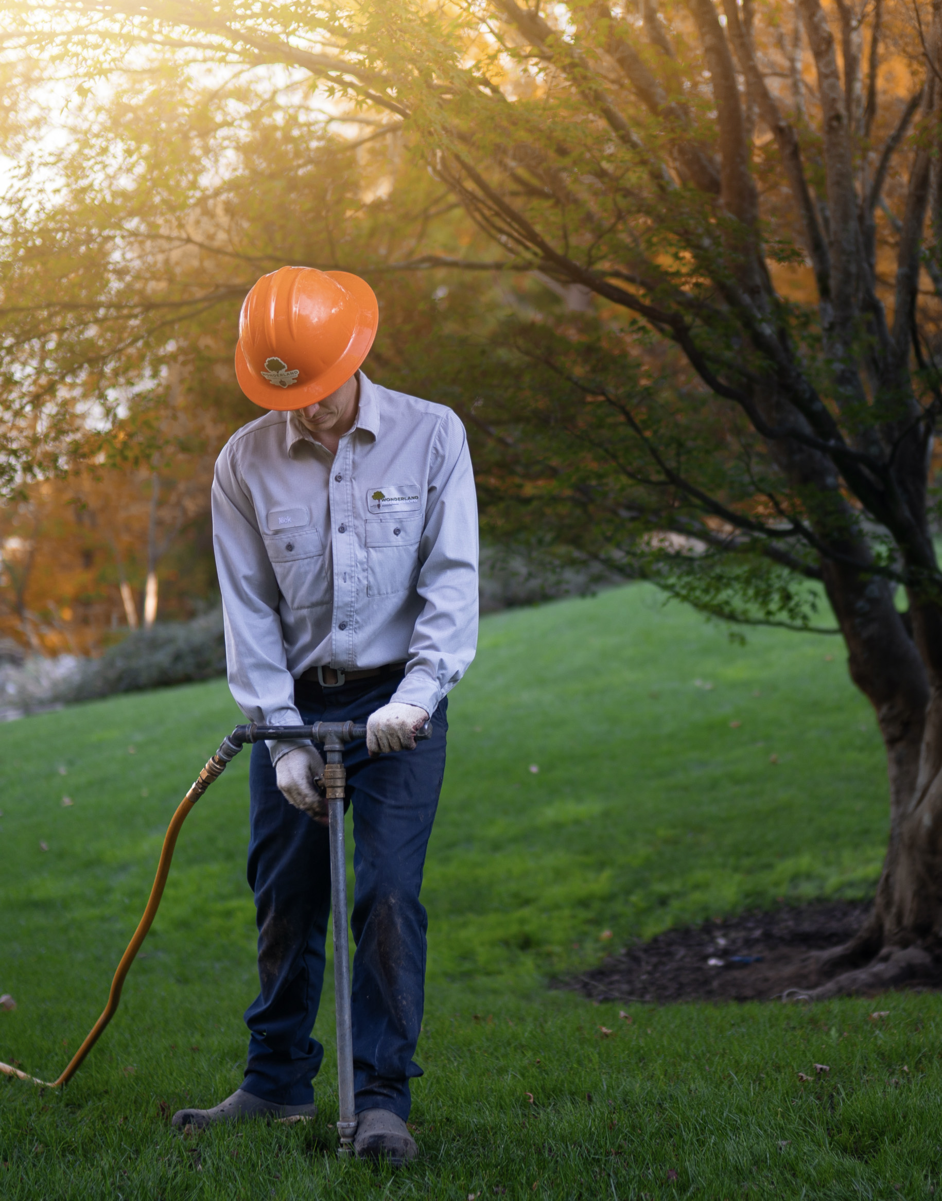 Wonderland technician applying treatment to a lawn