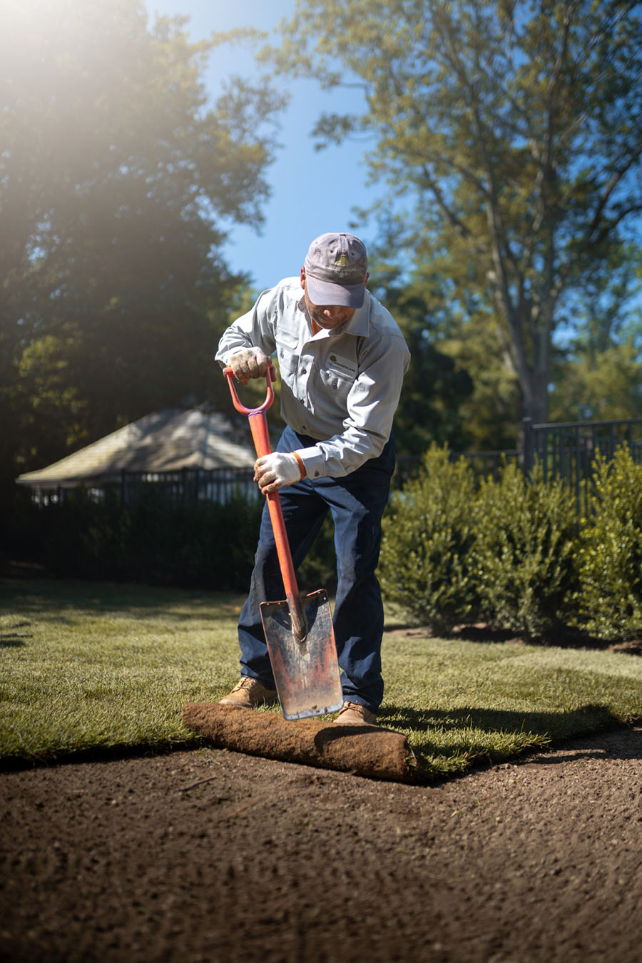 landscape technician installing sod